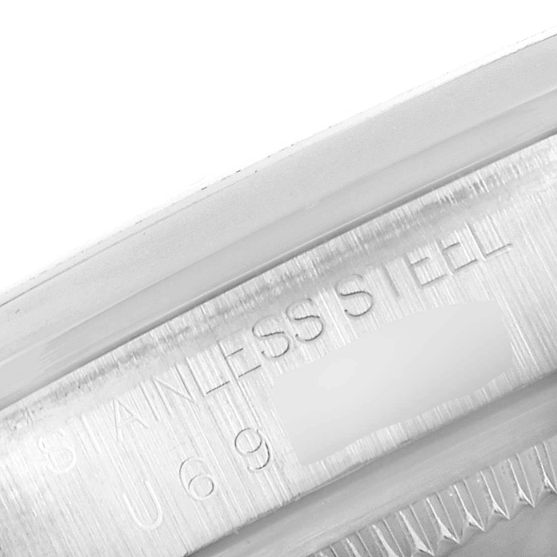 The image shows a close-up of the engraved "STAINLESS STEEL" detail on a Rolex Explorer 14270 Men's Stainless Steel Black Dial 14270 Men's Stainless Steel Black Dial watch.