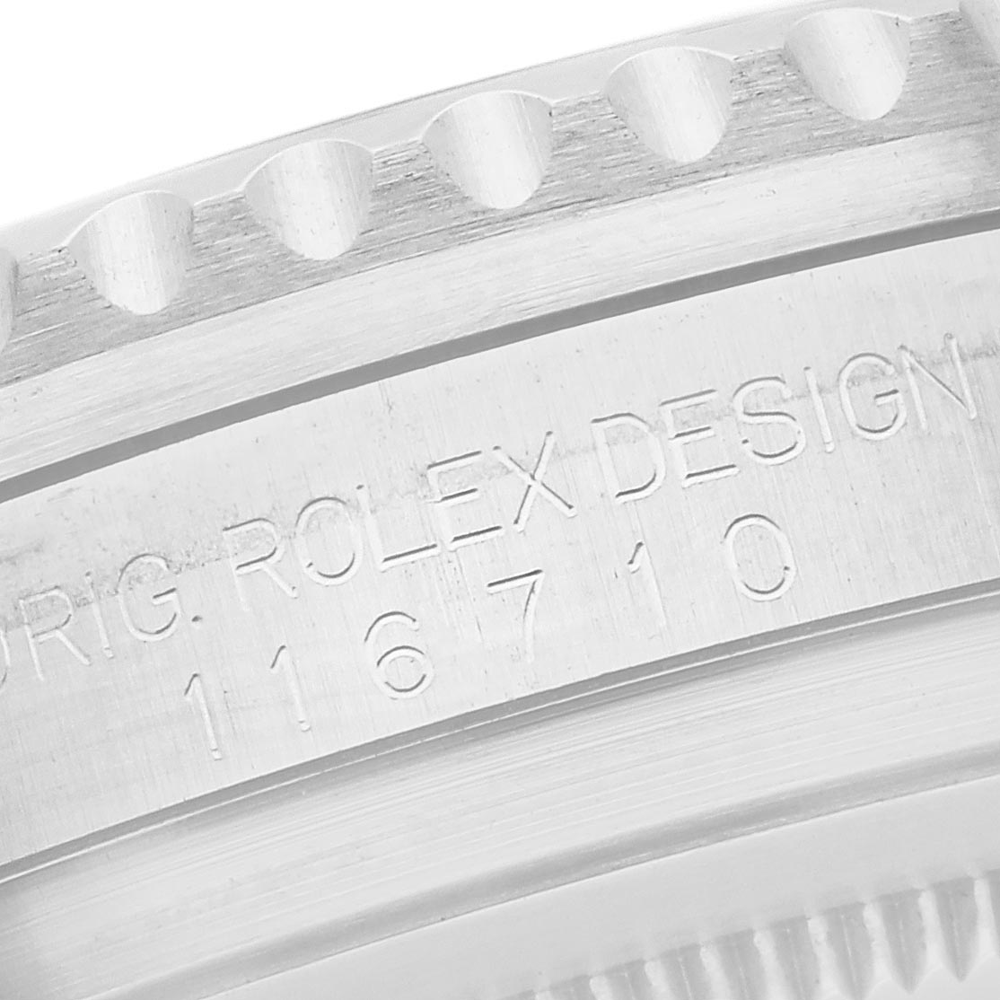 The image shows an angled close-up of the Rolex GMT-Master 116710 Men's Stainless Steel Black Dial 116710 Men's Stainless Steel Black Dial's case, highlighting the engraved reference number.