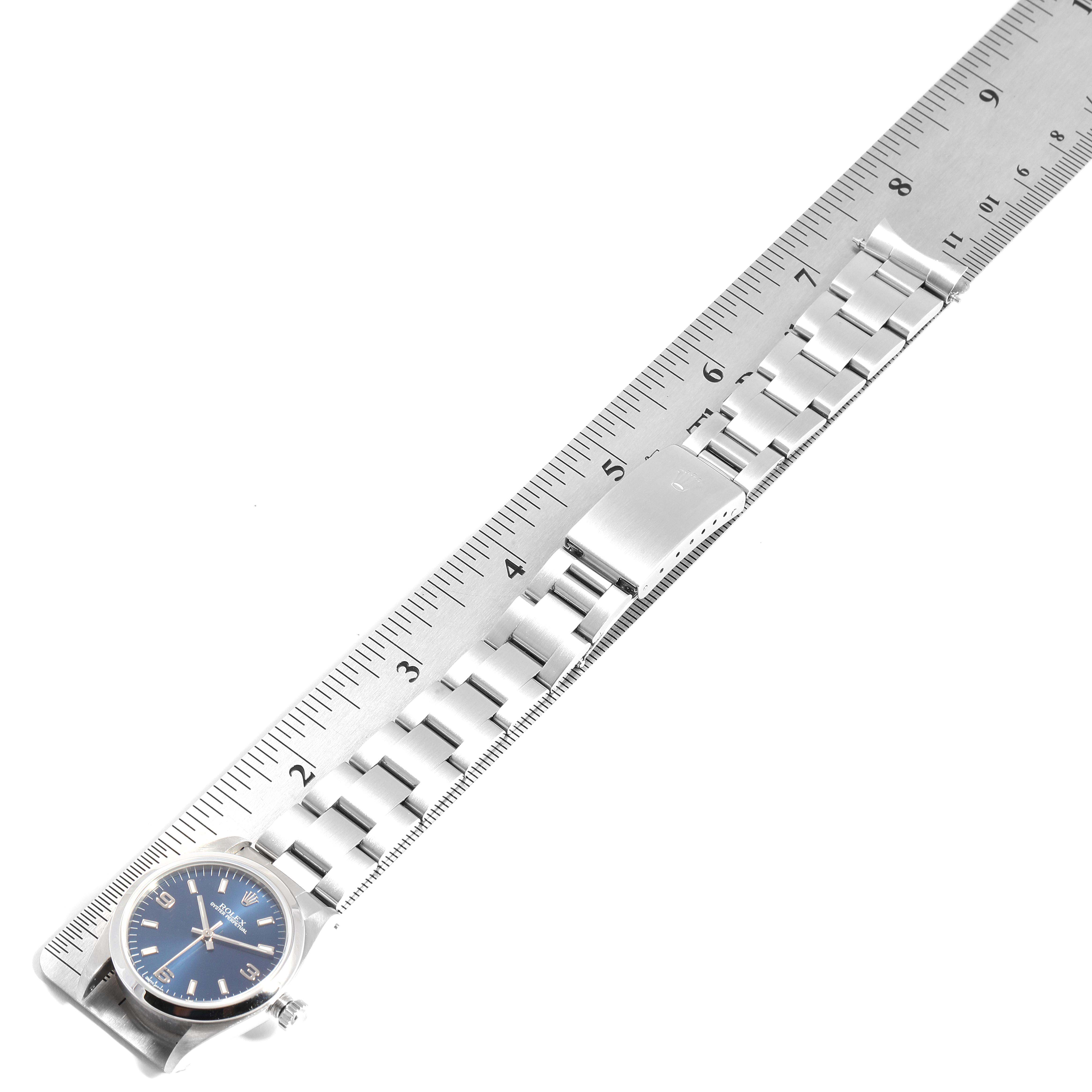 The image shows a fully extended Mid-Size Rolex watch with its bracelet measured against a ruler.