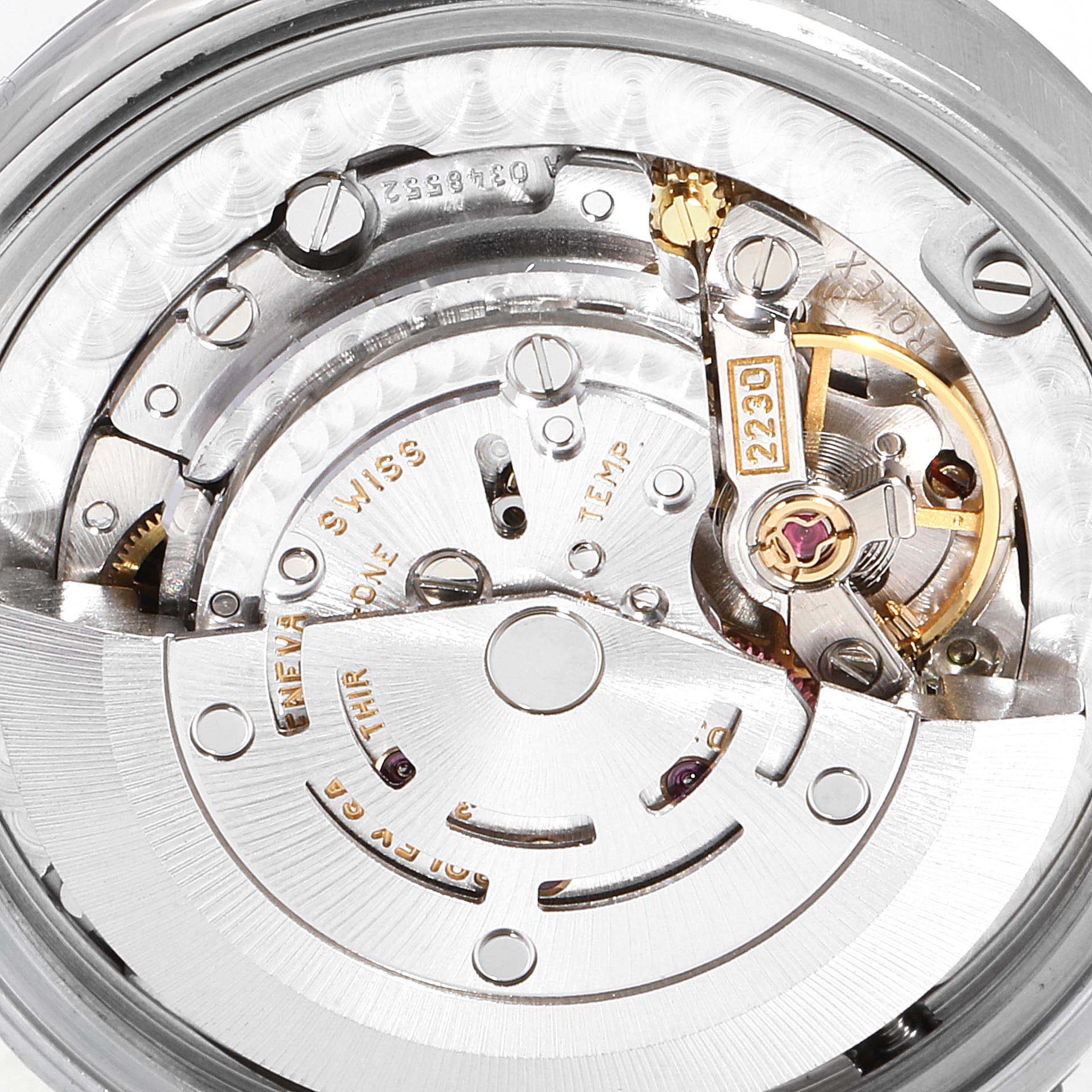 The image shows a close-up view of the movement and intricate internal components of a Rolex Mid-Size 77080 Women
s Stainless Steel Blue Dial 77080 Women
s Stainless Steel Blue Dial watch model 2230.