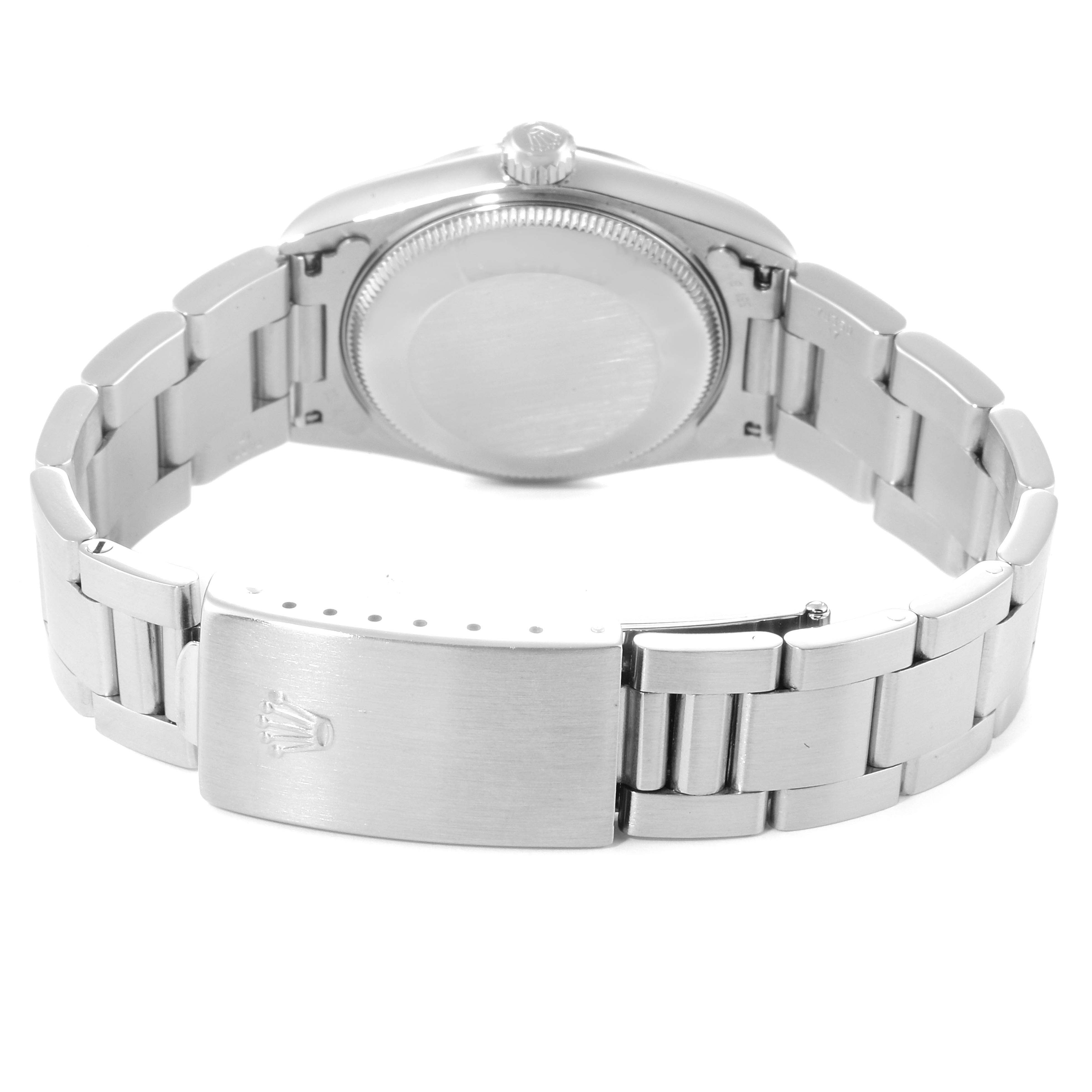 The image shows the back and clasp of a mid-size Rolex watch, with the band fully extended.