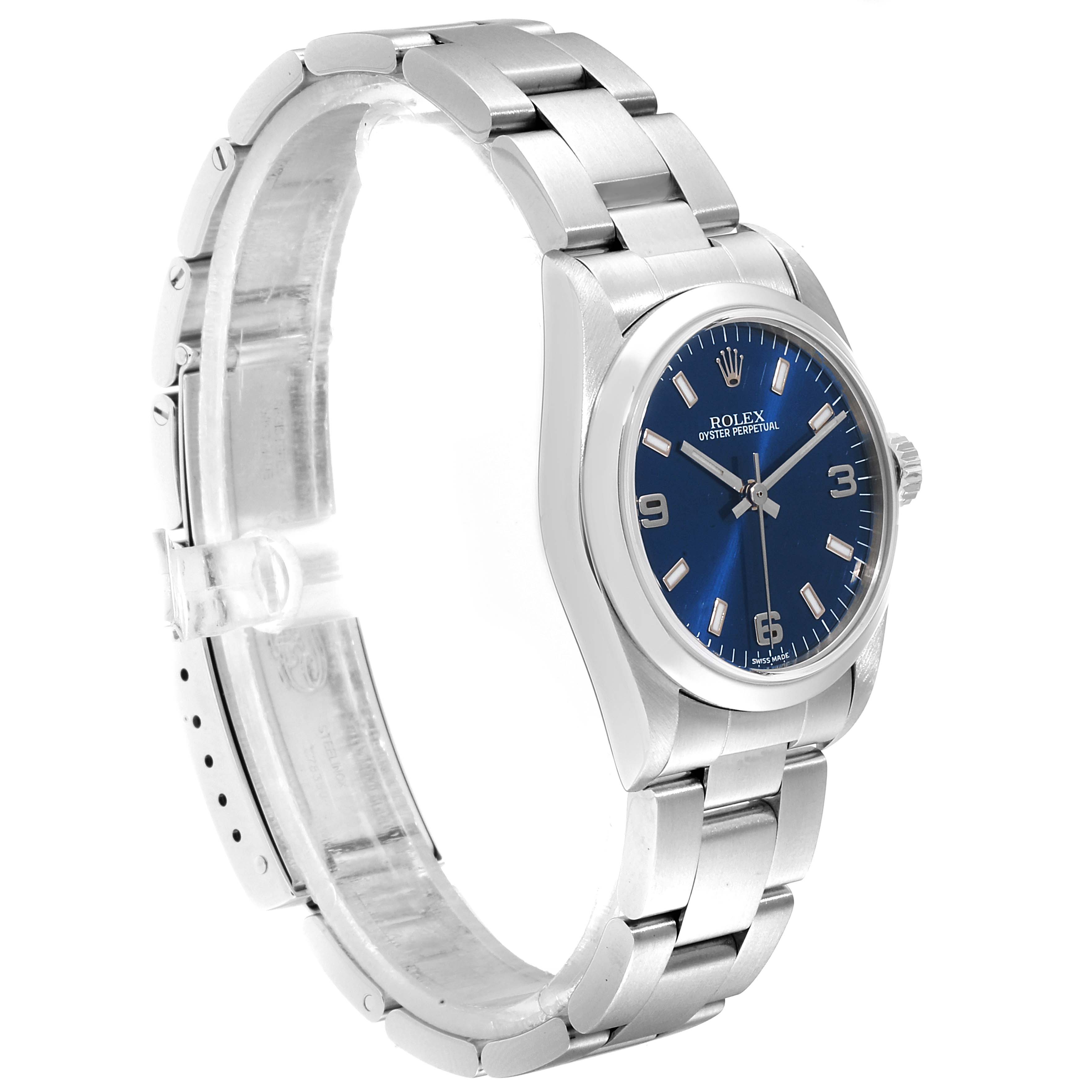 The Rolex Mid-Size 77080 Women
s Stainless Steel Blue Dial 77080 Women
s Stainless Steel Blue Dial watch is shown at a slight angle, showcasing its blue dial, bezel, crown, and bracelet.