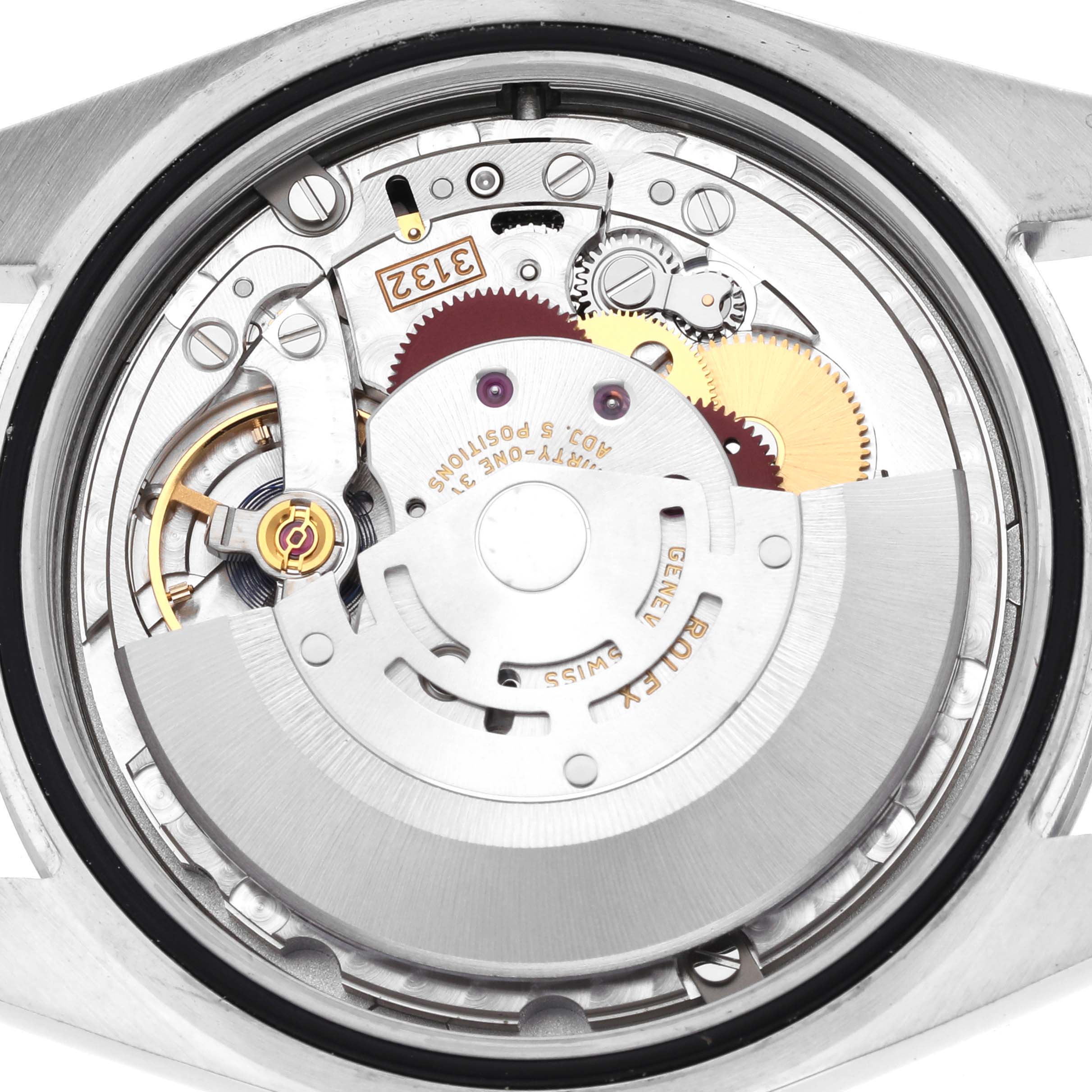 The image shows the movement from the back of a Rolex Oyster Perpetual 114300 Men
s Stainless Steel Grey Dial 114300 Men
s Stainless Steel Grey Dial, revealing gears and the rotor.