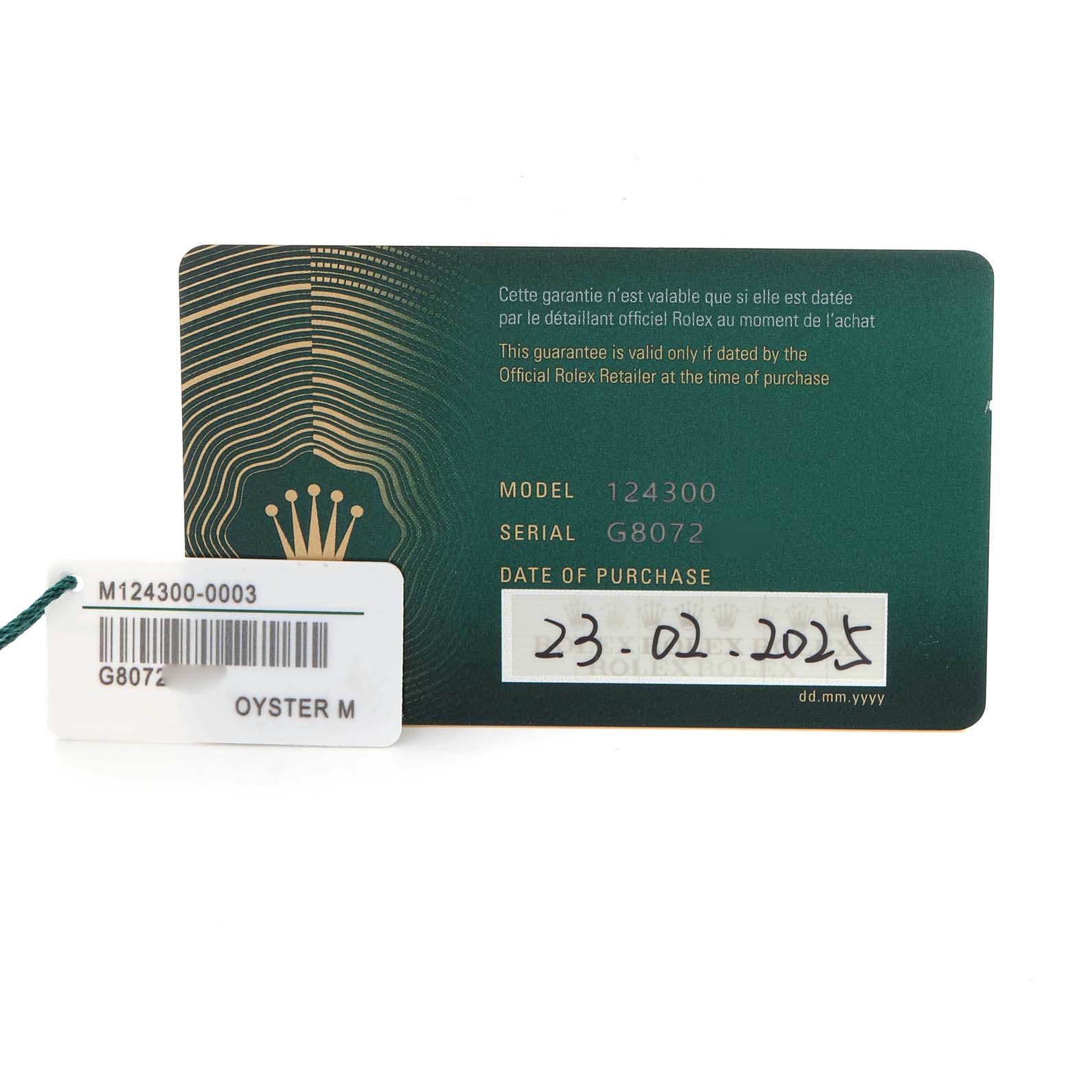 The image shows the warranty card and tag for a Rolex Oyster Perpetual 124300 Men
s Stainless Steel Blue Dial 124300 Men
s Stainless Steel Blue Dial model, displaying model and serial numbers.