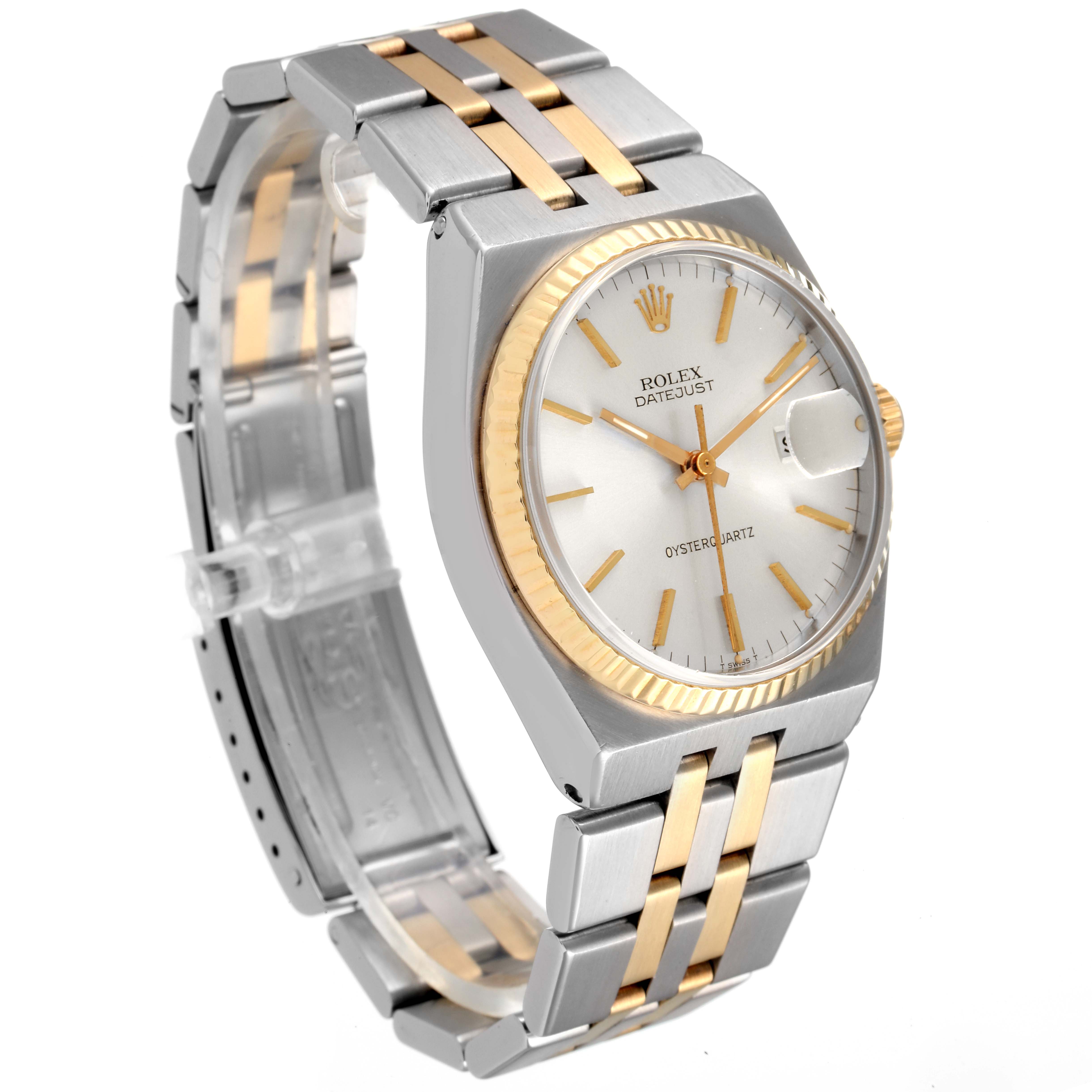 The image shows a Rolex Oysterquartz 17013 Men
s Steel and Gold (two tone) Silver Dial 17013 Men
s Steel and Gold (two tone) Silver Dial Datejust watch at a three-quarter angle, highlighting its two-tone bracelet and dial.