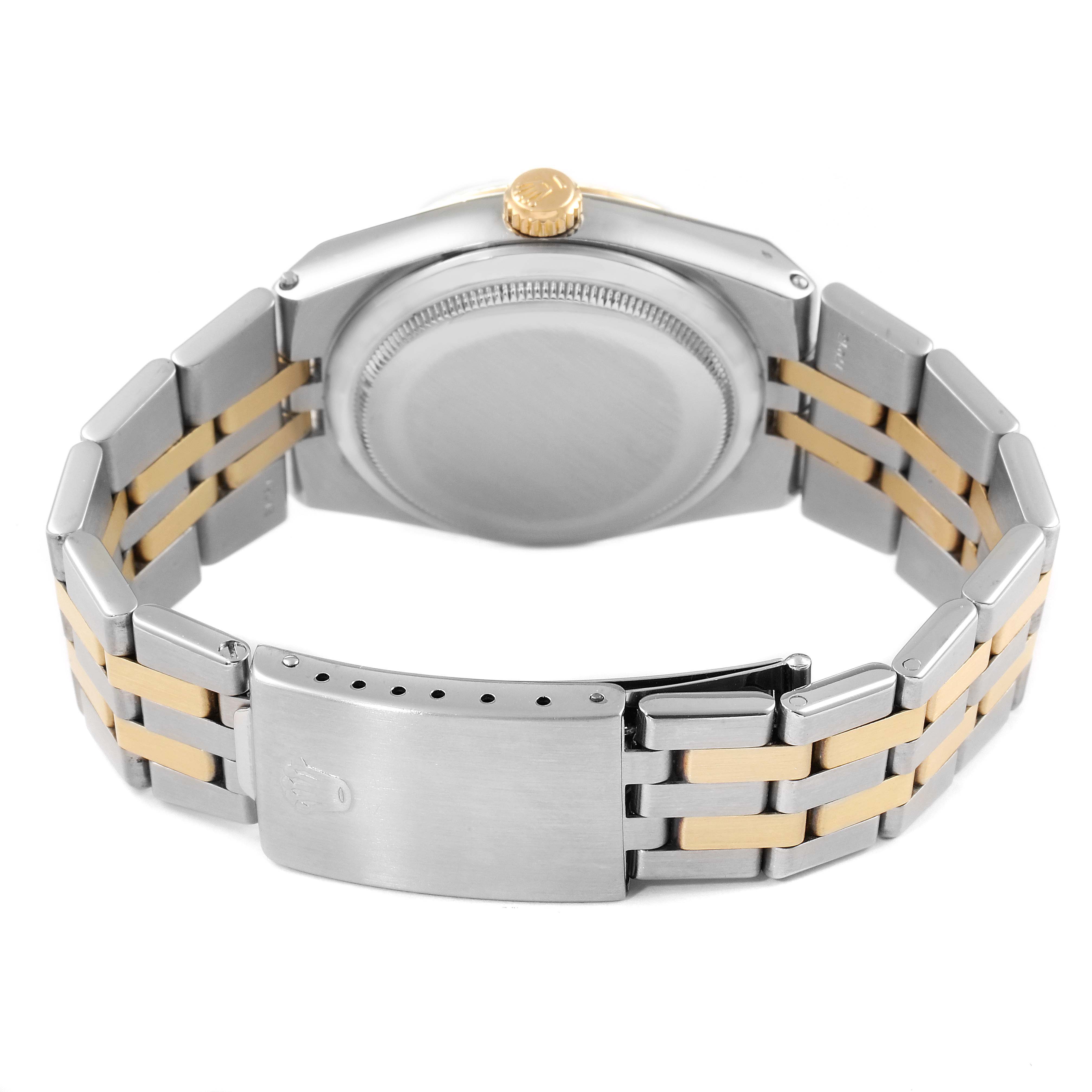 The image shows the back and bracelet of a Rolex Oysterquartz 17013 Men
s Steel and Gold (two tone) Silver Dial 17013 Men
s Steel and Gold (two tone) Silver Dial watch, including the clasp and crown, from a rear angle.