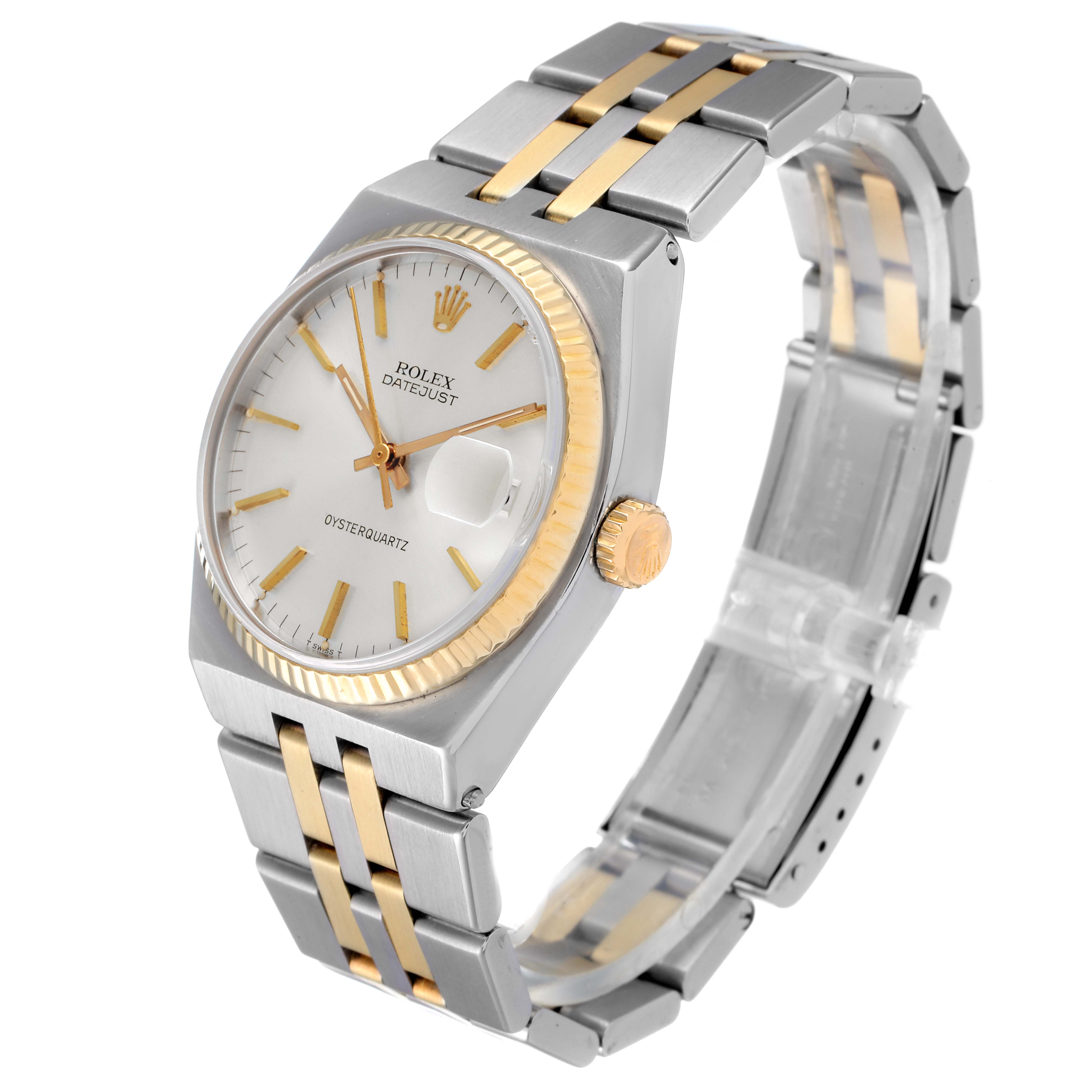 The image shows a Rolex Oysterquartz 17013 Men
s Steel and Gold (two tone) Silver Dial 17013 Men
s Steel and Gold (two tone) Silver Dial Datejust watch from an angled side view, highlighting the face, crown, and two-tone bracelet.