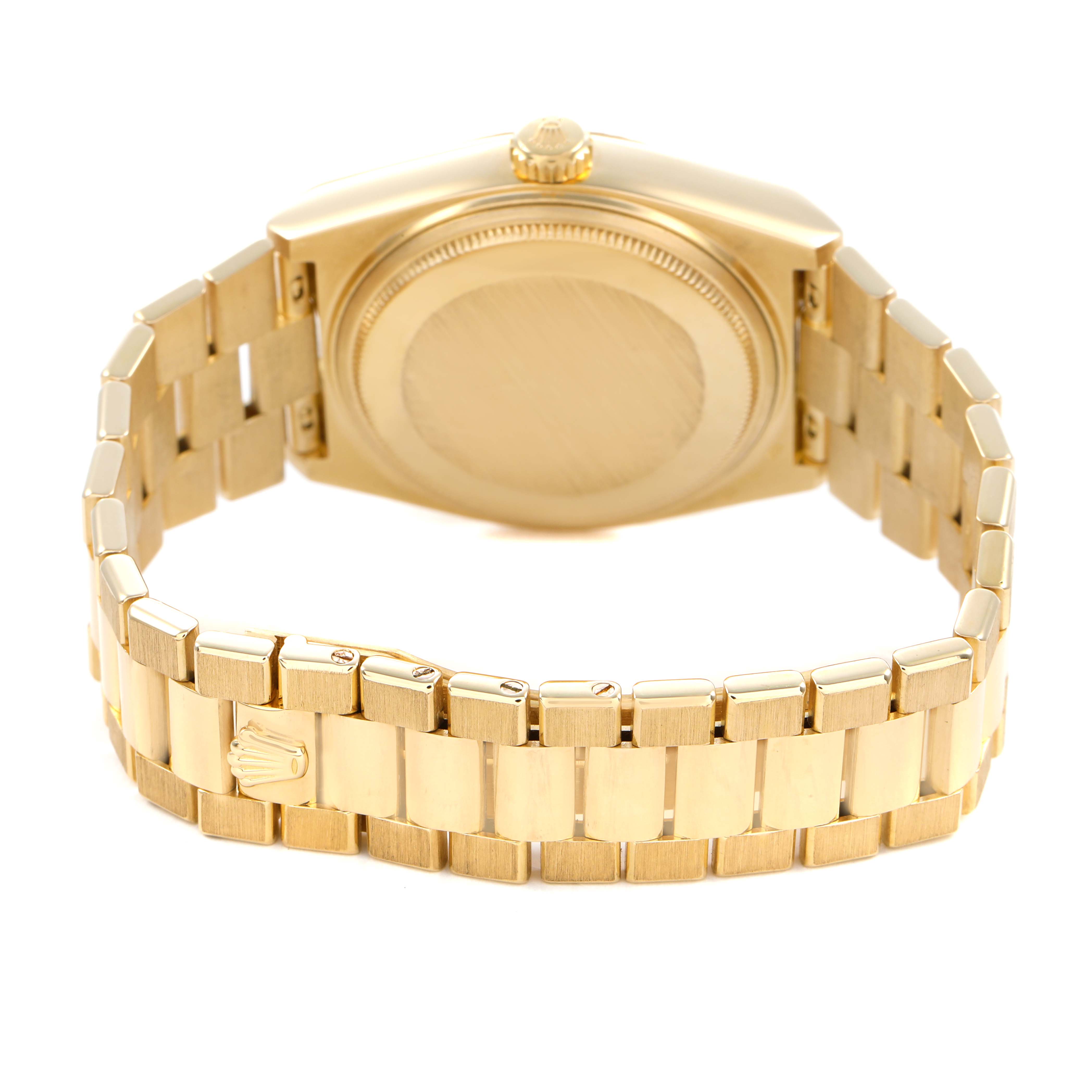 The image shows the back of a Rolex Oysterquartz 19018 Men's Yellow Gold Brown Dial watch, highlighting its gold case, crown, and bracelet.