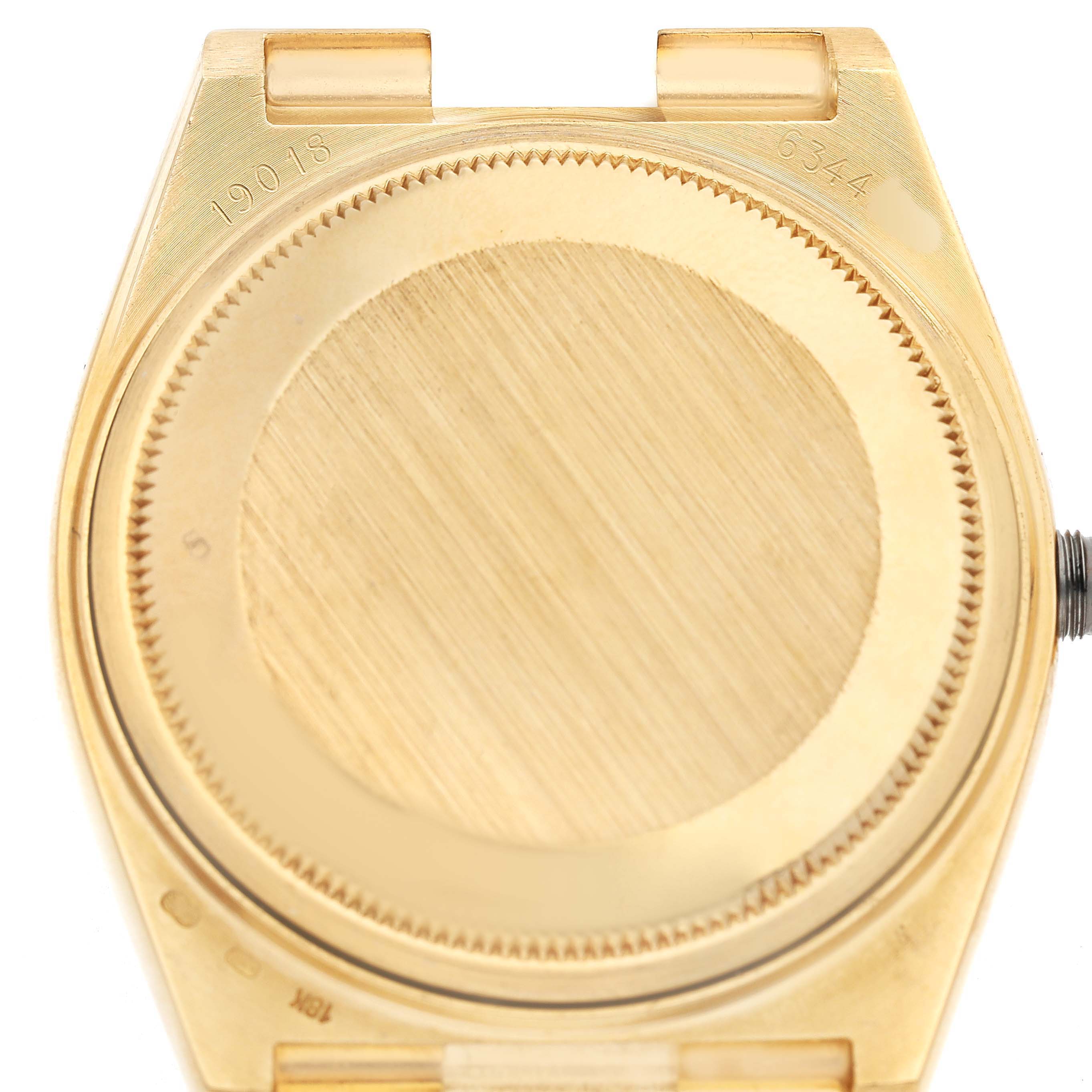 The image shows the back case of a Rolex Oysterquartz 19018 Men's Yellow Gold Brown Dial watch, viewed from directly behind without the band attached.