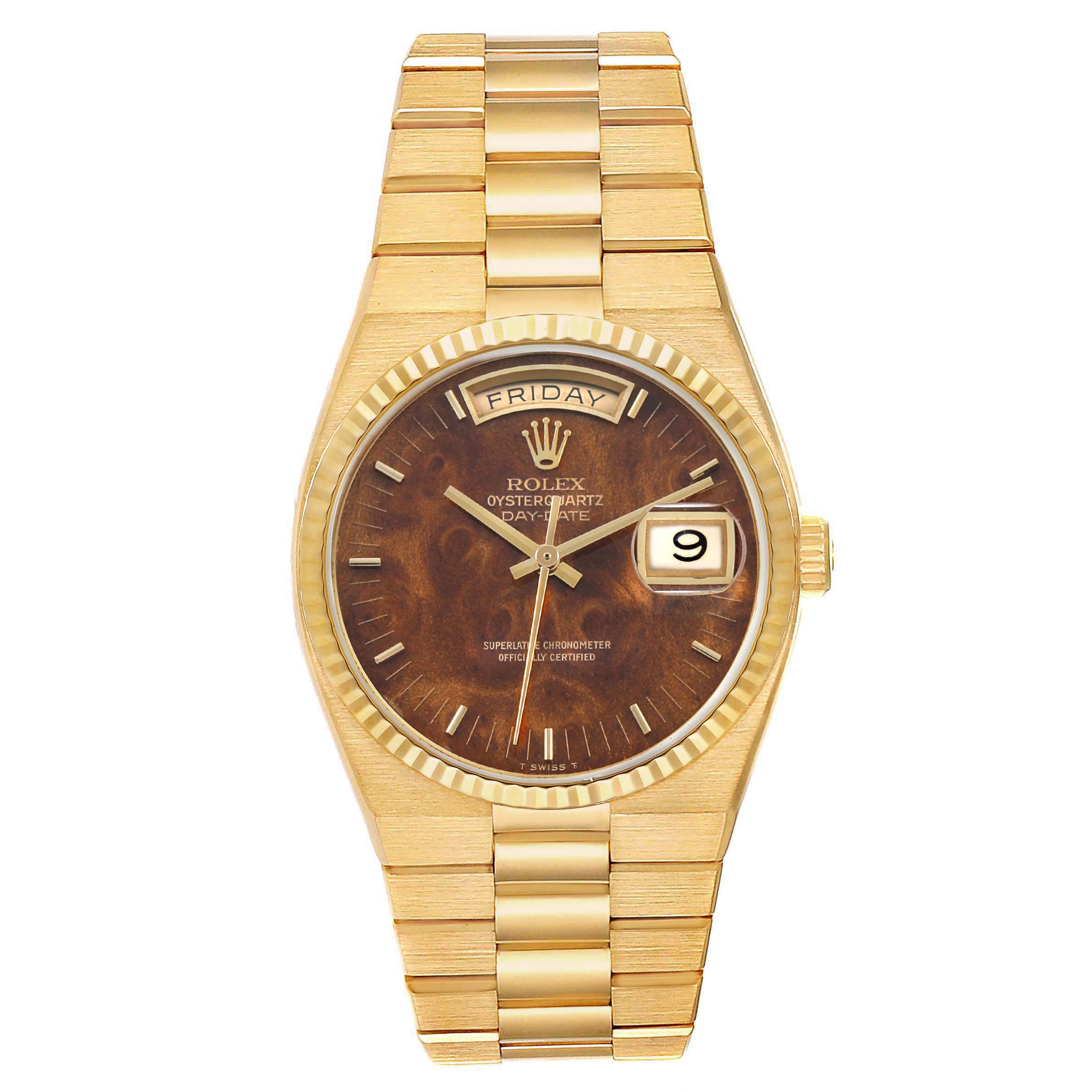 The Rolex Oysterquartz 19018 Men's Yellow Gold Brown Dial watch is shown from a top view, highlighting its gold bracelet, brown dial, day, and date features.