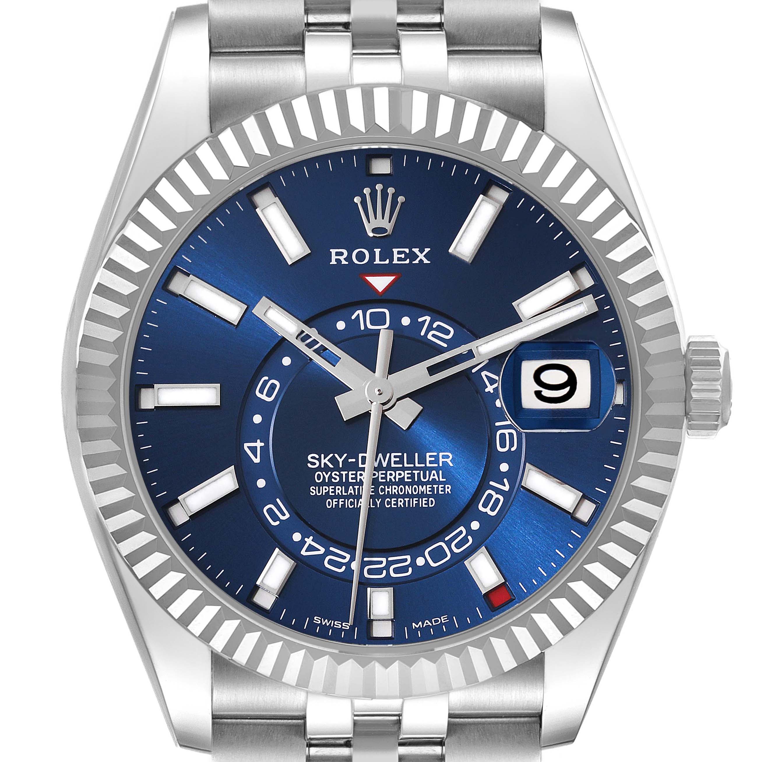 The image shows a frontal view of a Rolex Sky-Dweller 326934 Men
s Stainless Steel Blue Dial 326934 Men
s Stainless Steel Blue Dial watch highlighting its blue dial, date window, and fluted bezel.