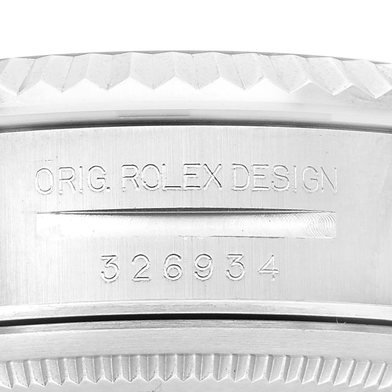 This close-up image shows the engraved reference number and "ORIG. ROLEX DESIGN" text on the side of a Rolex Sky-Dweller 326934 Men
s Stainless Steel Blue Dial 326934 Men
s Stainless Steel Blue Dial watch.