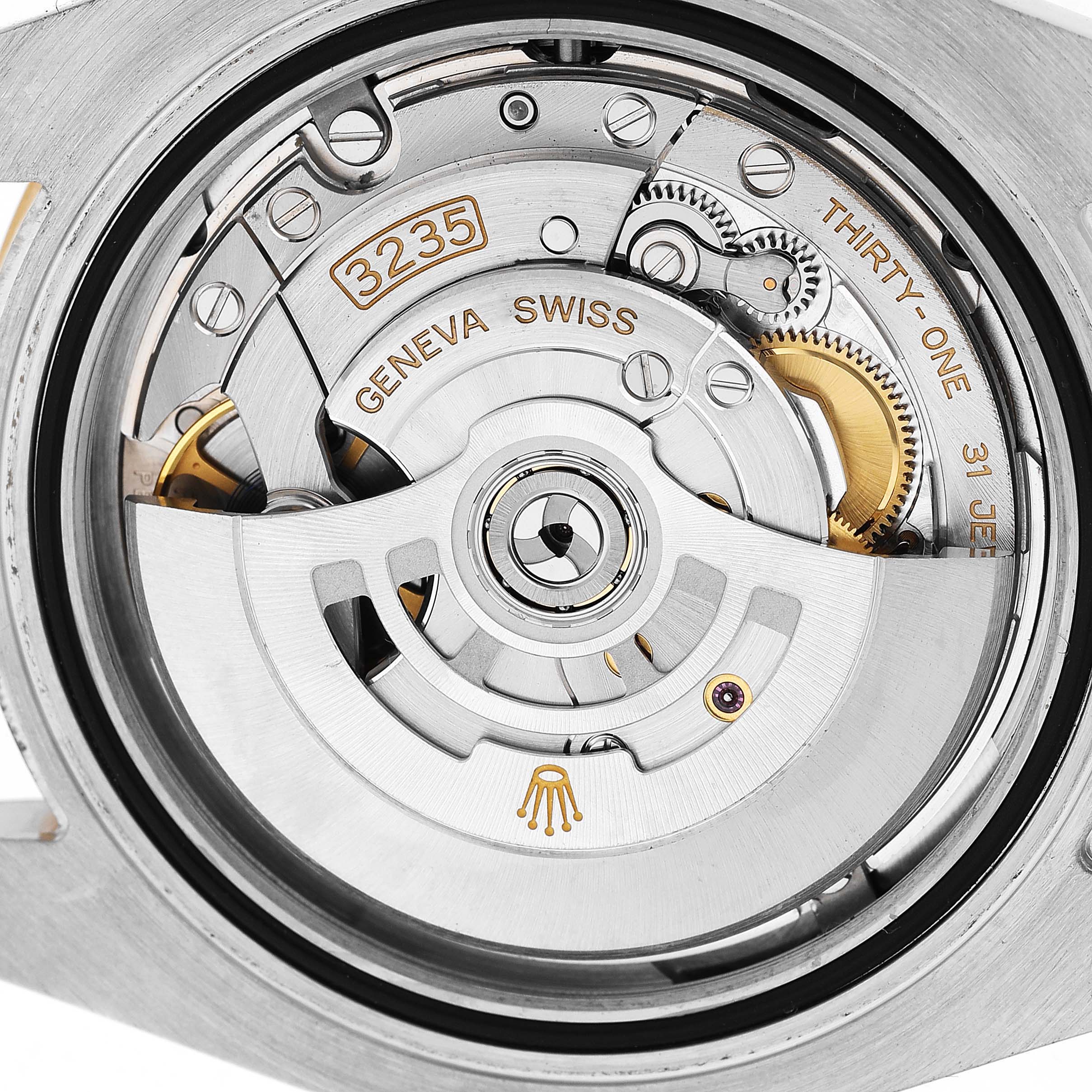 The image shows the movement of a Rolex Submariner 126613 Men's Steel and Gold (two tone) Blue Dial, focusing on the rotor, gears, and intricate components from the back.