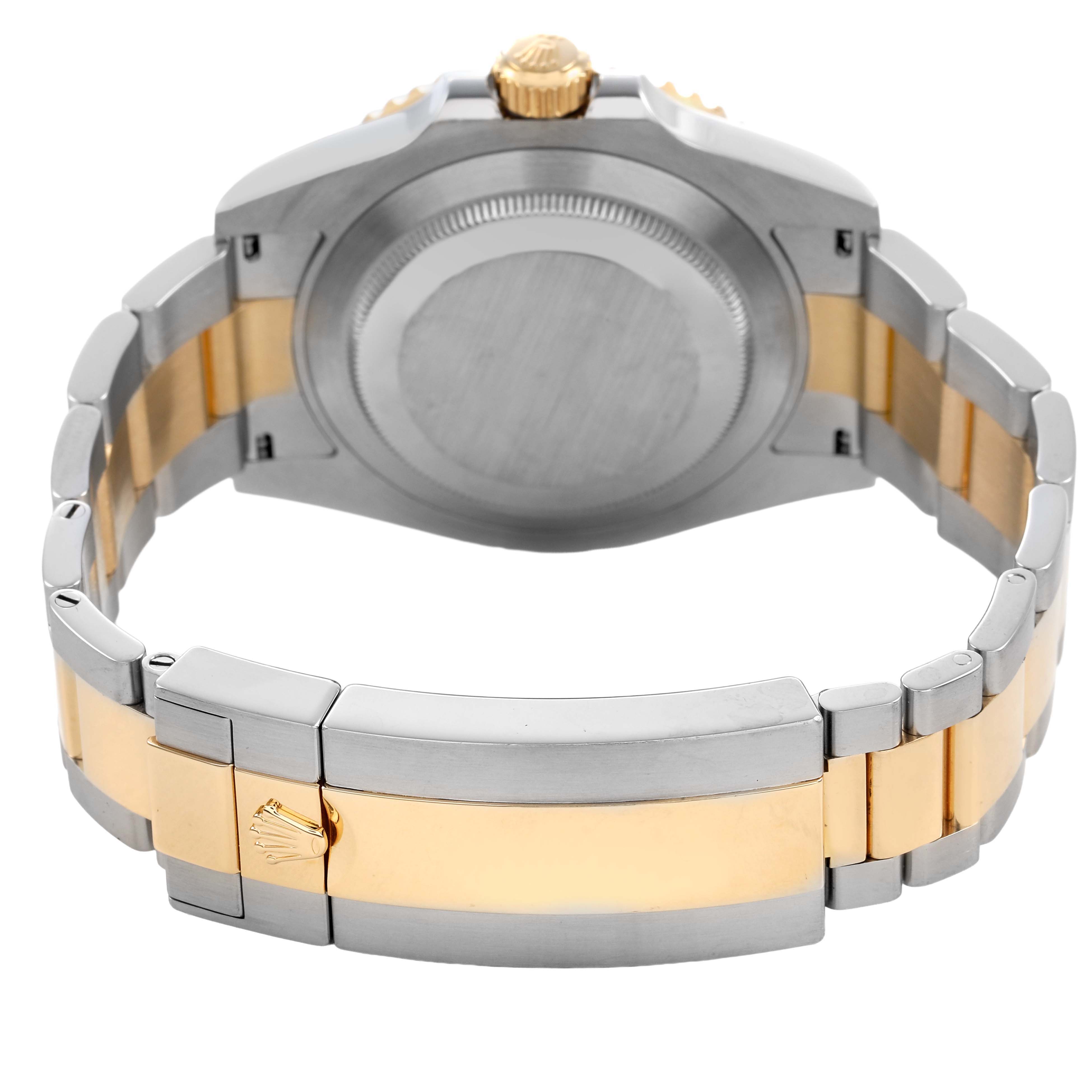 The image shows the back of a Rolex Submariner 126613 Men's Steel and Gold (two tone) Blue Dial watch, highlighting the case back, crown, and two-tone bracelet.