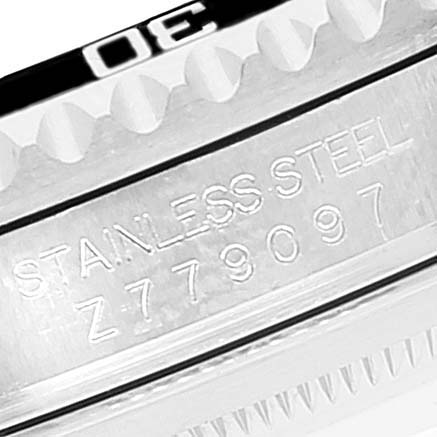 This image shows a close-up of the stainless steel case and serial number of a Rolex Submariner 16610 Men
s Stainless Steel Black Dial 16610 Men
s Stainless Steel Black Dial watch.