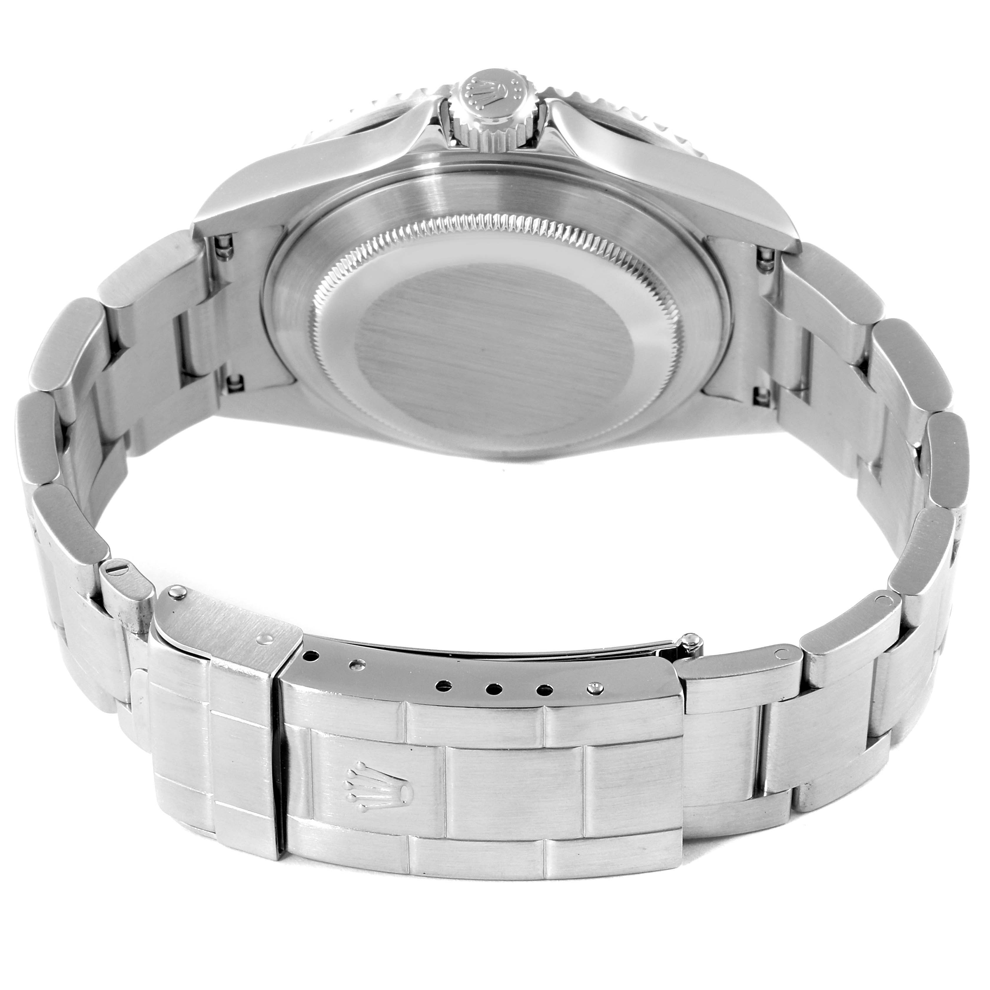 The image displays the back view of a Rolex Submariner 16610 Men
s Stainless Steel Black Dial 16610 Men
s Stainless Steel Black Dial watch, highlighting its case back, crown, and metal bracelet with a clasp.