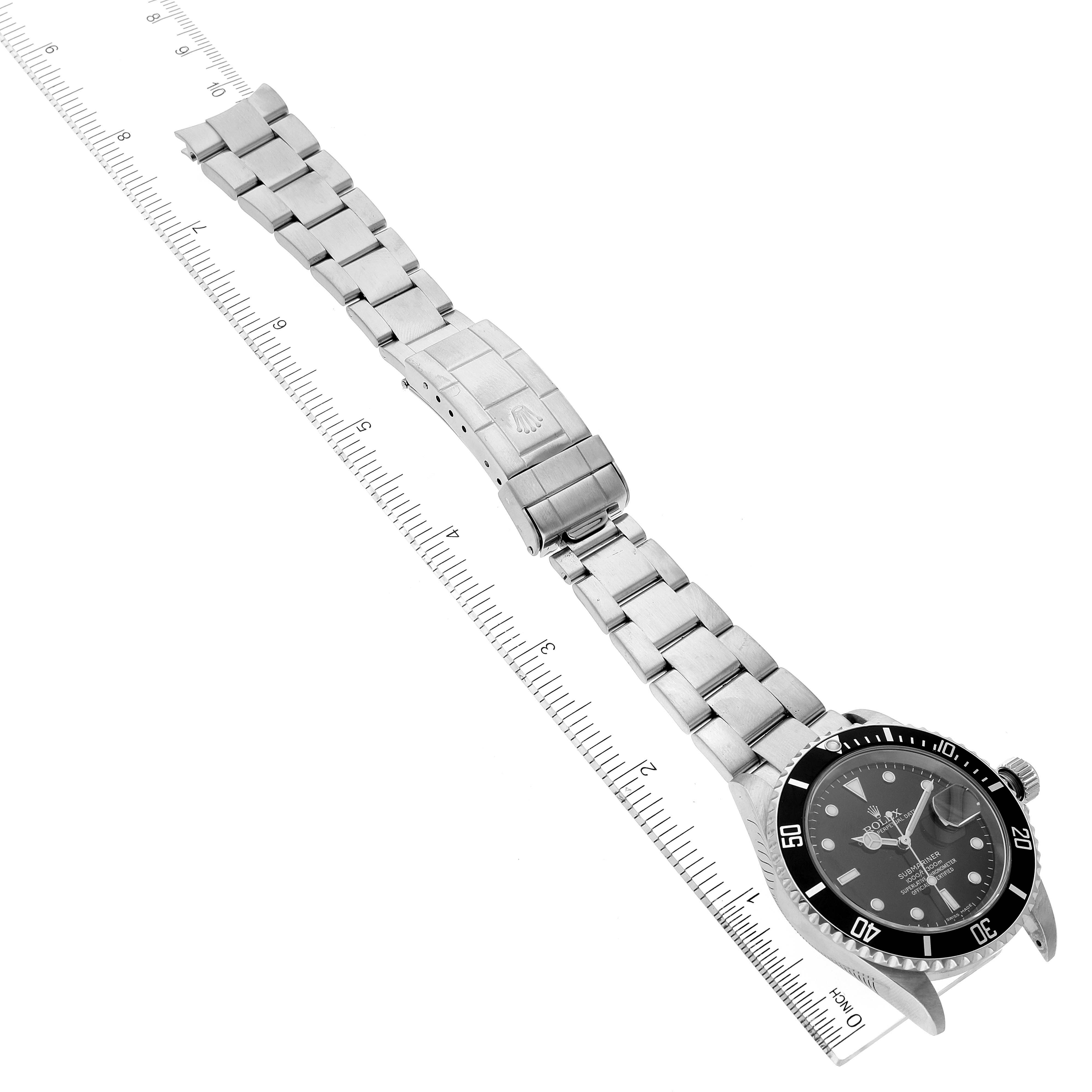 The image shows a top-down view of a Rolex Submariner 16610 Men
s Stainless Steel Black Dial 16610 Men
s Stainless Steel Black Dial watch, focusing on the dial, bezel, and bracelet strap.