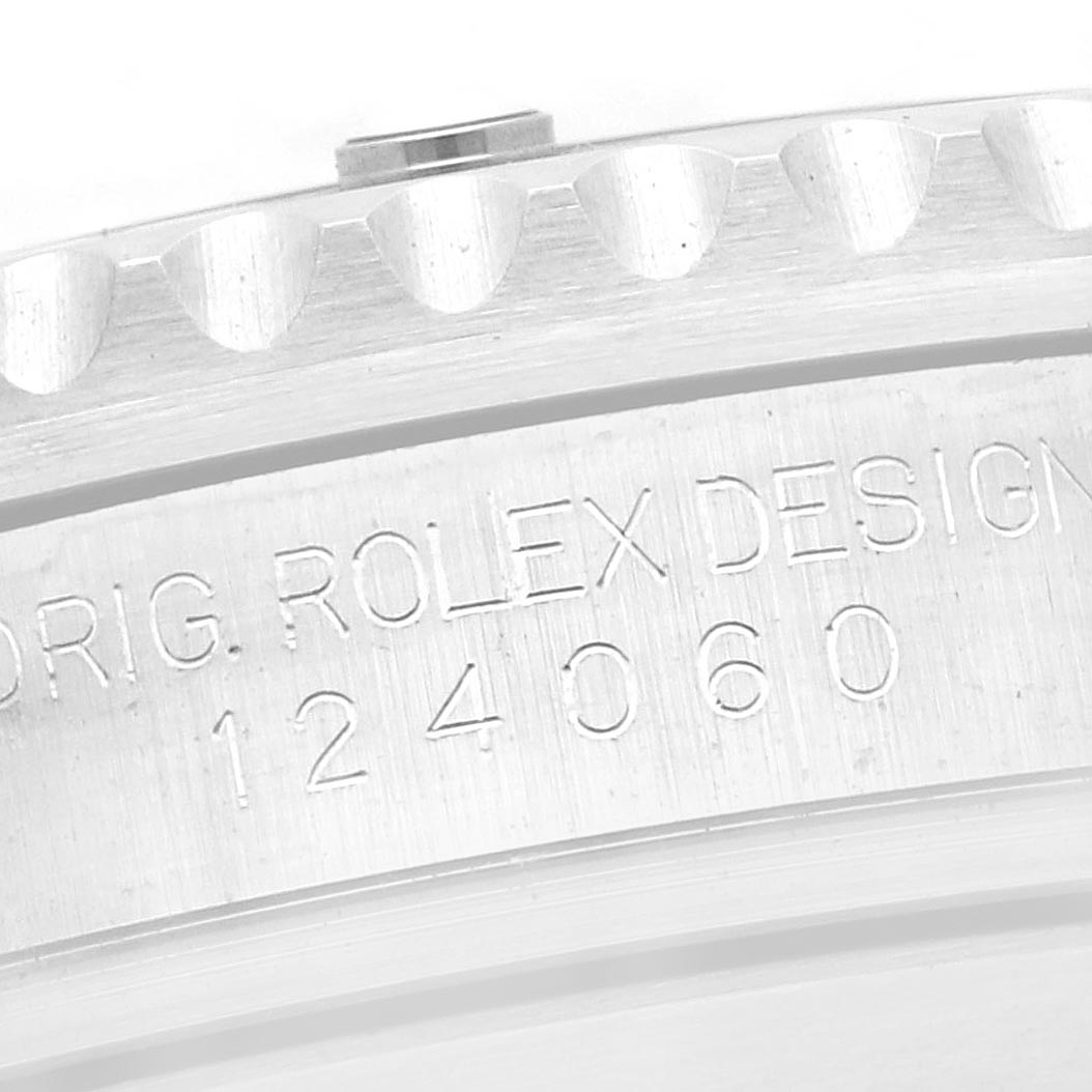 The image shows a close-up of the engraved side of the Rolex Submariner 124060 Men
s Stainless Steel Black Dial 124060 Men
s Stainless Steel Black Dial watch case, displaying the model number.