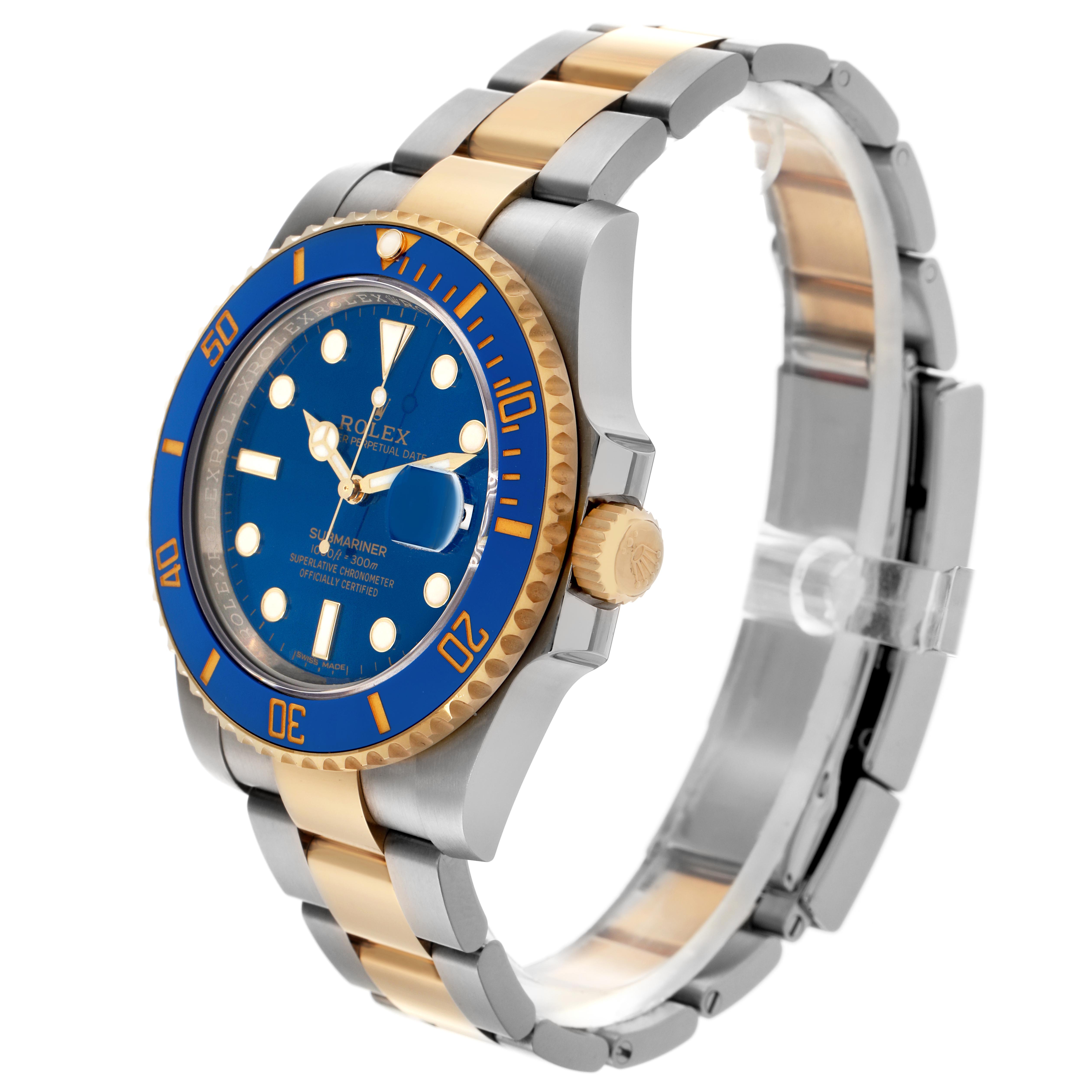 This image shows a Rolex Submariner 116613 Men
s Steel and Gold (two tone) Blue Dial 116613 Men
s Steel and Gold (two tone) Blue Dial watch in a side angle, highlighting the blue dial, gold bezel, and two-tone bracelet.