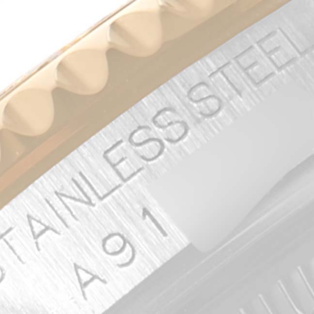 The image shows a close-up of the bezel and part of the casing of a Rolex Yacht-Master 168623 Men's Steel and Gold (two tone) Grey Dial 168623 Men's Steel and Gold (two tone) Grey Dial watch.