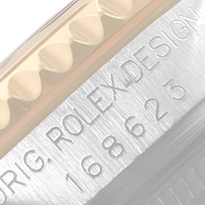 This image shows a close-up of the bezel and engraved serial number on the Rolex Yacht-Master 168623 Men's Steel and Gold (two tone) Grey Dial 168623 Men's Steel and Gold (two tone) Grey Dial watch.