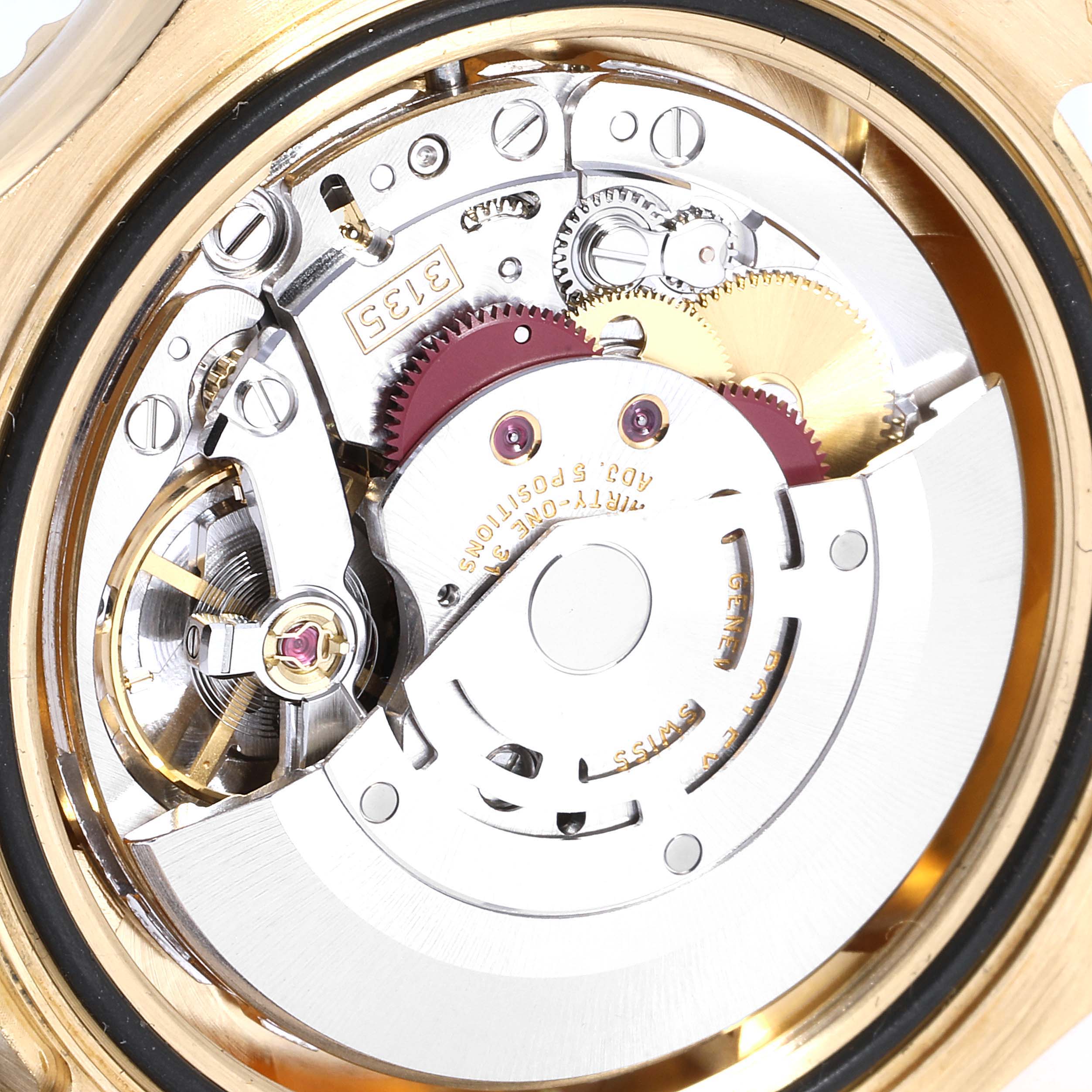 The image shows the intricate inner mechanism of a Rolex Yacht-Master 16628 Men
s Yellow Gold White Dial 16628 Men
s Yellow Gold White Dial watch from a rear angle.