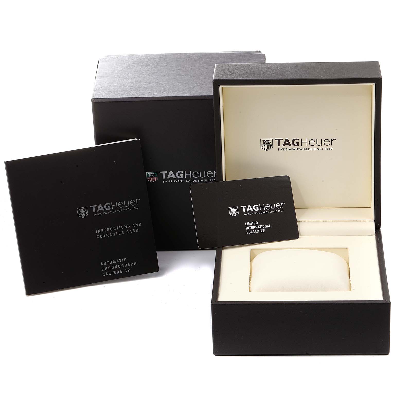 The image shows the packaging, instruction manual, and guarantee cards for the Tag Heuer Monaco CAW2111 Men's Steel and Gold (two tone) Blue Dial CAW2111 Men's Steel and Gold (two tone) Blue Dial model.