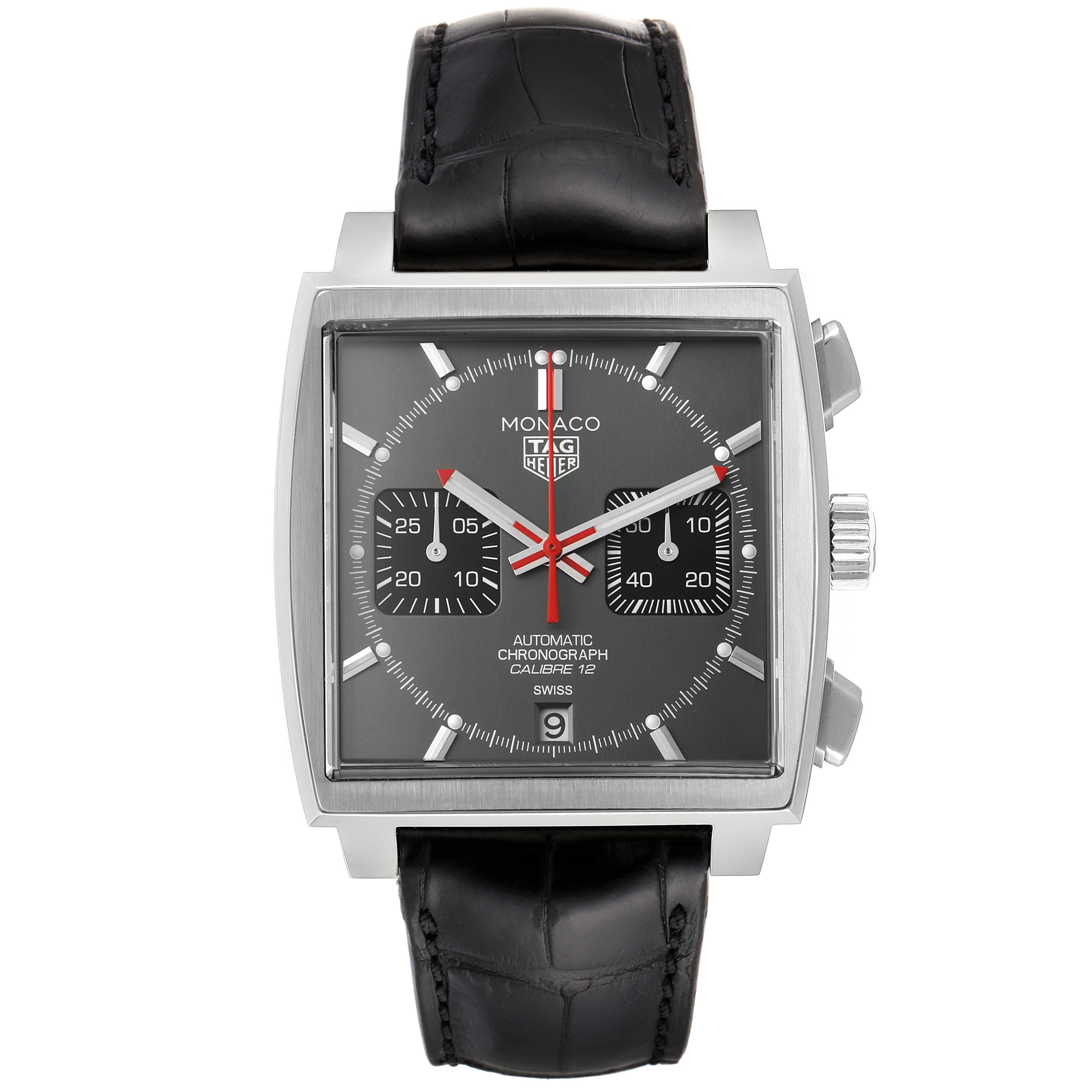 The image shows a front view of the Tag Heuer Monaco watch, featuring a square dial, two subdials, and a black leather strap.