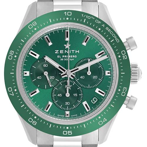 The Zenith Chronomaster watch is shown from a frontal angle, highlighting its green bezel and subdials.