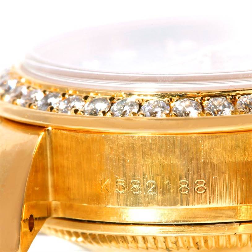 This image shows a close-up of the bezel and serial number area of a Rolex President 179138 Women's Yellow Gold Mother of Pearl Dial 179138 Women's Yellow Gold Mother of Pearl Dial model watch, showcasing diamond detailing.