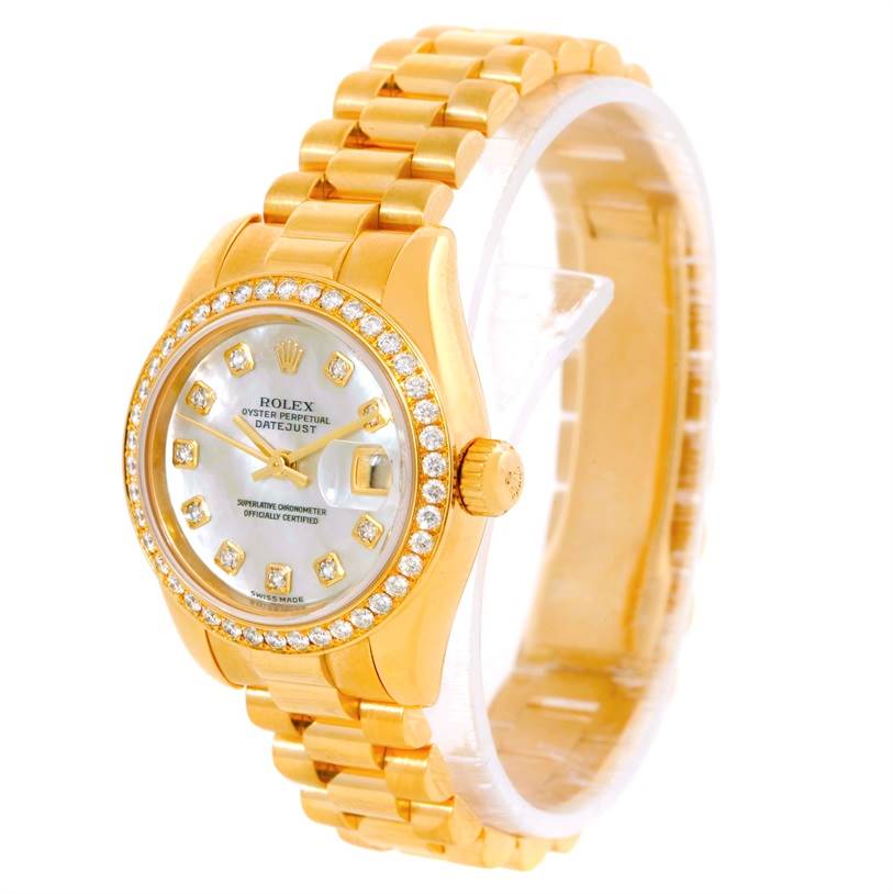The image shows a Rolex President 179138 Women's Yellow Gold Mother of Pearl Dial 179138 Women's Yellow Gold Mother of Pearl Dial model watch at a slight angle, highlighting its gold bracelet, diamond bezel, and dial.