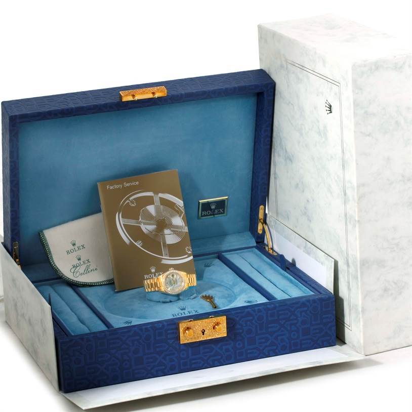 The Rolex President 179138 Women's Yellow Gold Mother of Pearl Dial 179138 Women's Yellow Gold Mother of Pearl Dial model watch is shown at a slight angle within its presentation box, along with booklets and accessories.