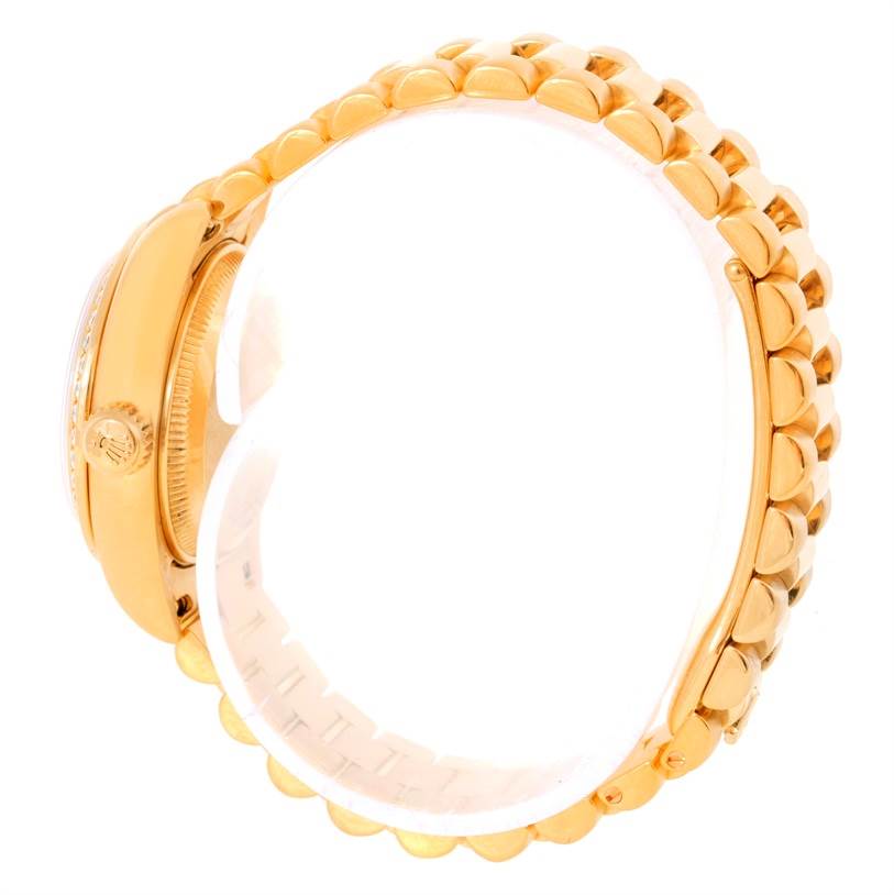 The image shows the side profile and part of the bracelet of a Rolex President 179138 Women's Yellow Gold Mother of Pearl Dial 179138 Women's Yellow Gold Mother of Pearl Dial model watch.