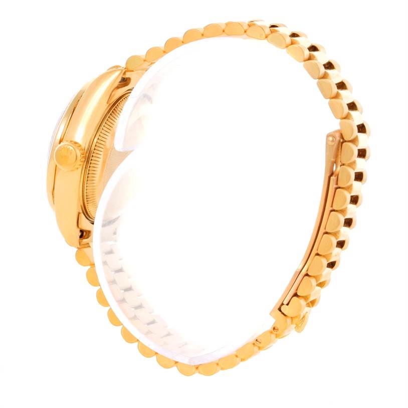 The image shows a side view of the Rolex President 69158 Women's Yellow Gold Champagne Dial 69158 Women's Yellow Gold Champagne Dial model, highlighting its gold case and bracelet.