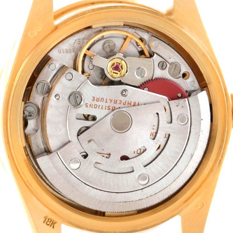 The image shows the inner mechanism of a Rolex President 69158 Women's Yellow Gold Champagne Dial 69158 Women's Yellow Gold Champagne Dial watch from a back view, highlighting its intricate movement and components.