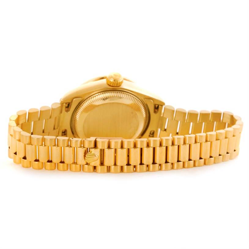 This image shows the back case and bracelet of a Rolex President 69158 Women's Yellow Gold Champagne Dial 69158 Women's Yellow Gold Champagne Dial model watch.