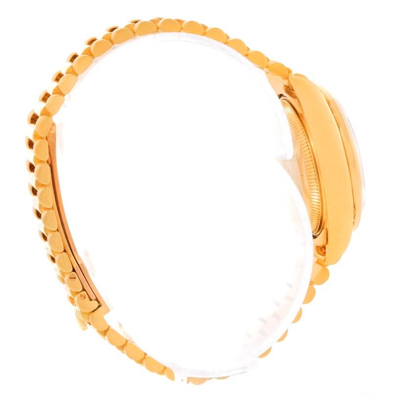 The image shows the side view of a Rolex President 69158 Women's Yellow Gold Champagne Dial 69158 Women's Yellow Gold Champagne Dial model watch, focusing on the band and the edge of the case.