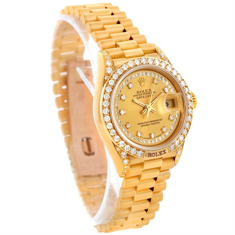 The Rolex President 69158 Women's Yellow Gold Champagne Dial 69158 Women's Yellow Gold Champagne Dial model watch is shown at an angled view, highlighting its gold case, diamond bezel, dial, and bracelet.