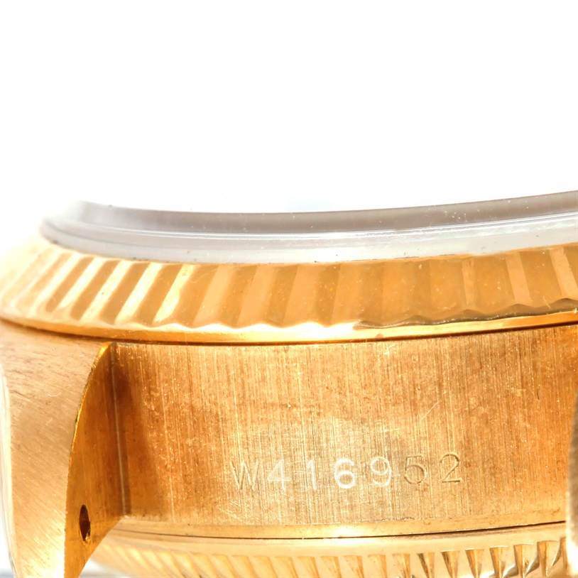The image shows a close-up side view of the gold case and fluted bezel of a Rolex President 69178 Women's Yellow Gold Black Dial 69178 Women's Yellow Gold Black Dial watch.