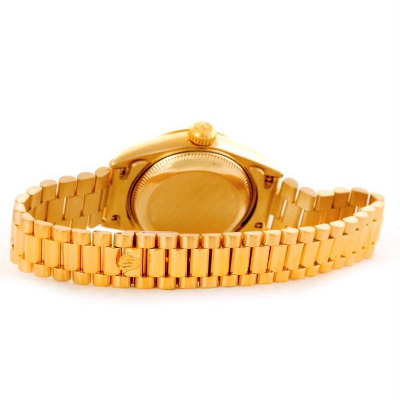 The image shows the back case and bracelet of a Rolex President 69178 Women's Yellow Gold Black Dial 69178 Women's Yellow Gold Black Dial model watch from a rear angle.