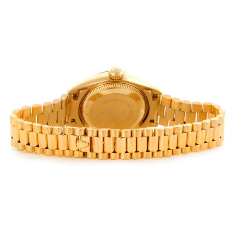 The image shows the back view of a Rolex President 69178 Women's Yellow Gold Brown Dial 69178 Women's Yellow Gold Brown Dial model, highlighting the case back and bracelet.