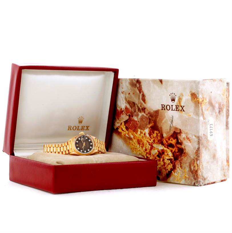 The image shows a Rolex President 69178 Women's Yellow Gold Brown Dial 69178 Women's Yellow Gold Brown Dial model watch in its box, placed at a slight angle, with the box lid open and the outer box beside it.