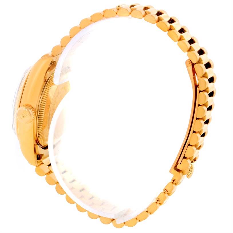 This side view of the Rolex President 69178 Women's Yellow Gold Brown Dial 69178 Women's Yellow Gold Brown Dial model shows the crown, case, and gold link bracelet.