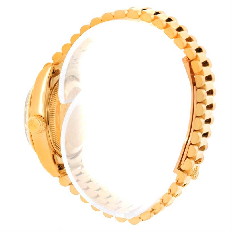 This Rolex President 69178 Women's Yellow Gold Champagne Dial 69178 Women's Yellow Gold Champagne Dial model watch is shown in a side view, highlighting the band and crown.