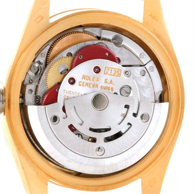The image shows the inner mechanics and movement of a Rolex President 69178 Women's Yellow Gold Champagne Dial 69178 Women's Yellow Gold Champagne Dial model watch, viewed from the case back.