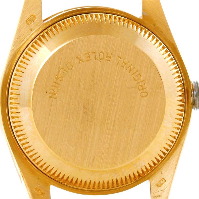 This image shows the back case of the Rolex President 69178 Women's Yellow Gold Champagne Dial 69178 Women's Yellow Gold Champagne Dial model watch from a top-down angle.