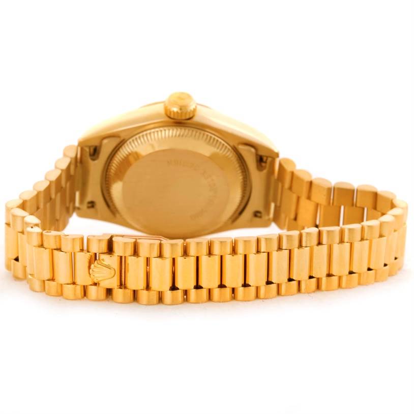 The image shows the back and bracelet of a Rolex President 69178 Women's Yellow Gold Champagne Dial 69178 Women's Yellow Gold Champagne Dial model watch from a rear angle.