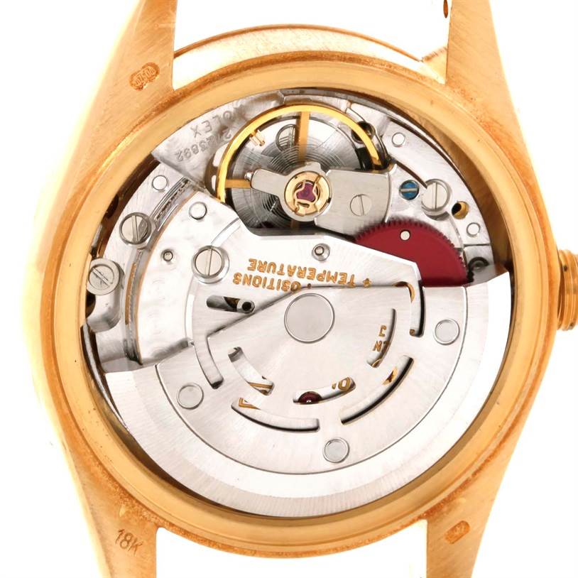 This image shows the internal mechanics and movement of a Rolex President 69178 Women's Yellow Gold Champagne Dial 69178 Women's Yellow Gold Champagne Dial model watch from a rear view angle.
