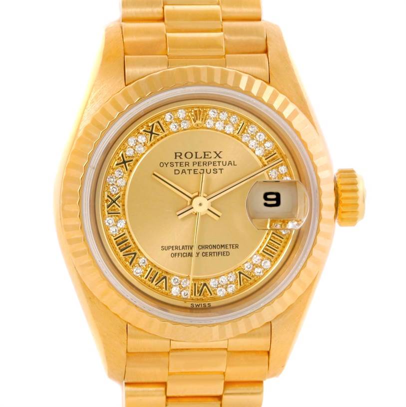 The image shows a close-up of the Rolex President 69178 Women's Yellow Gold Champagne Dial 69178 Women's Yellow Gold Champagne Dial model watch, highlighting the gold dial, Roman numerals, and date magnifier.