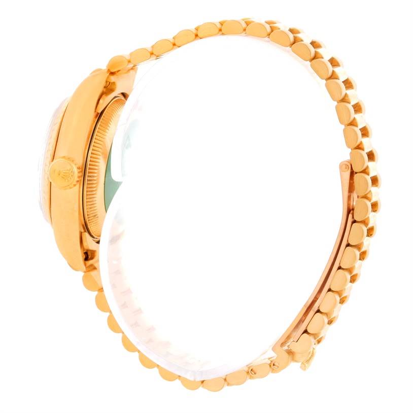 The image shows a side view of a Rolex President 69178 Women's Yellow Gold Champagne Dial 69178 Women's Yellow Gold Champagne Dial model watch, highlighting its crown, case, and linked bracelet.